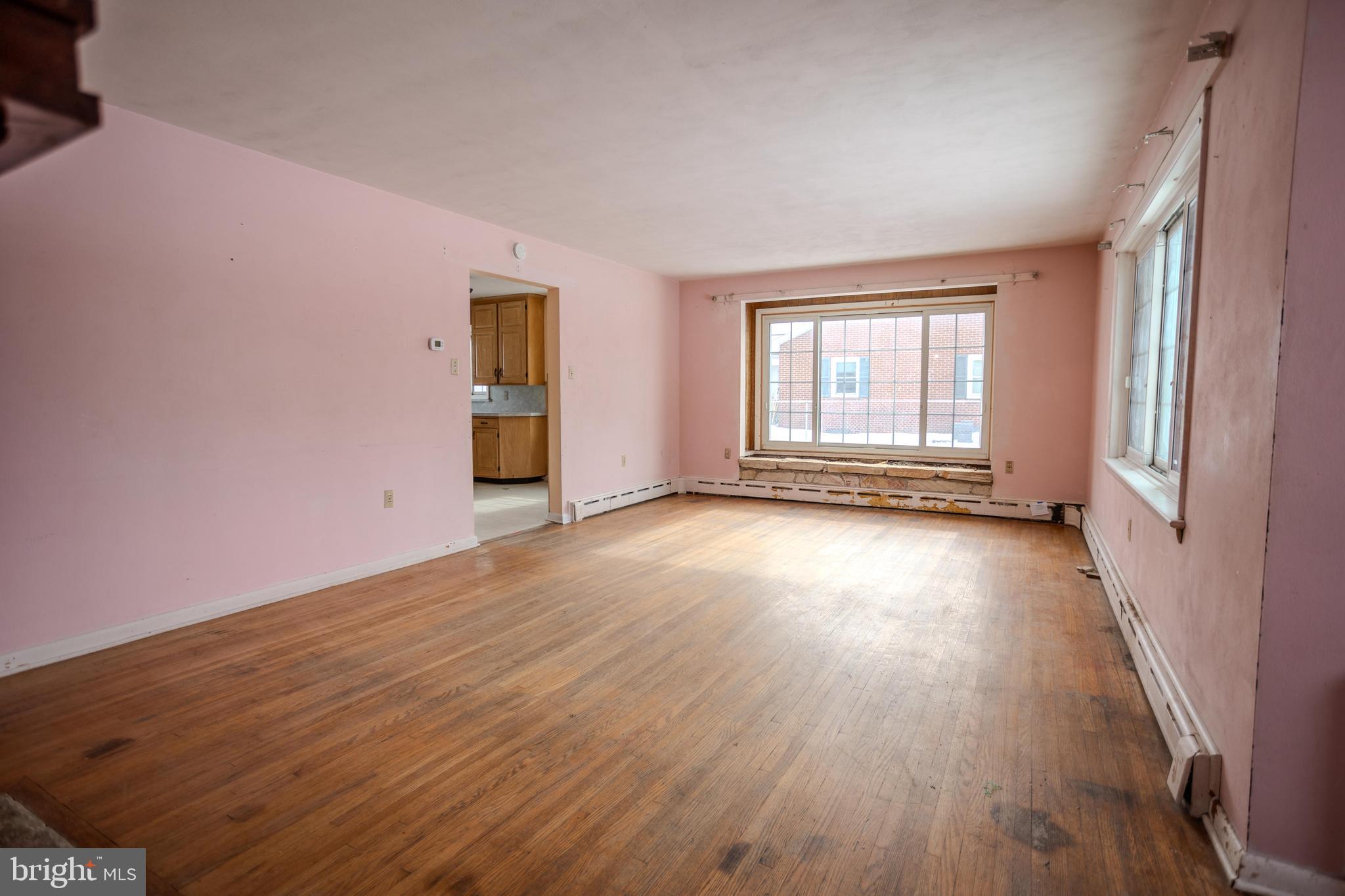 241 Wagner Road Chambersburg, PA 17202 - Photo 12 of 37 an empty room with wooden floor and windows