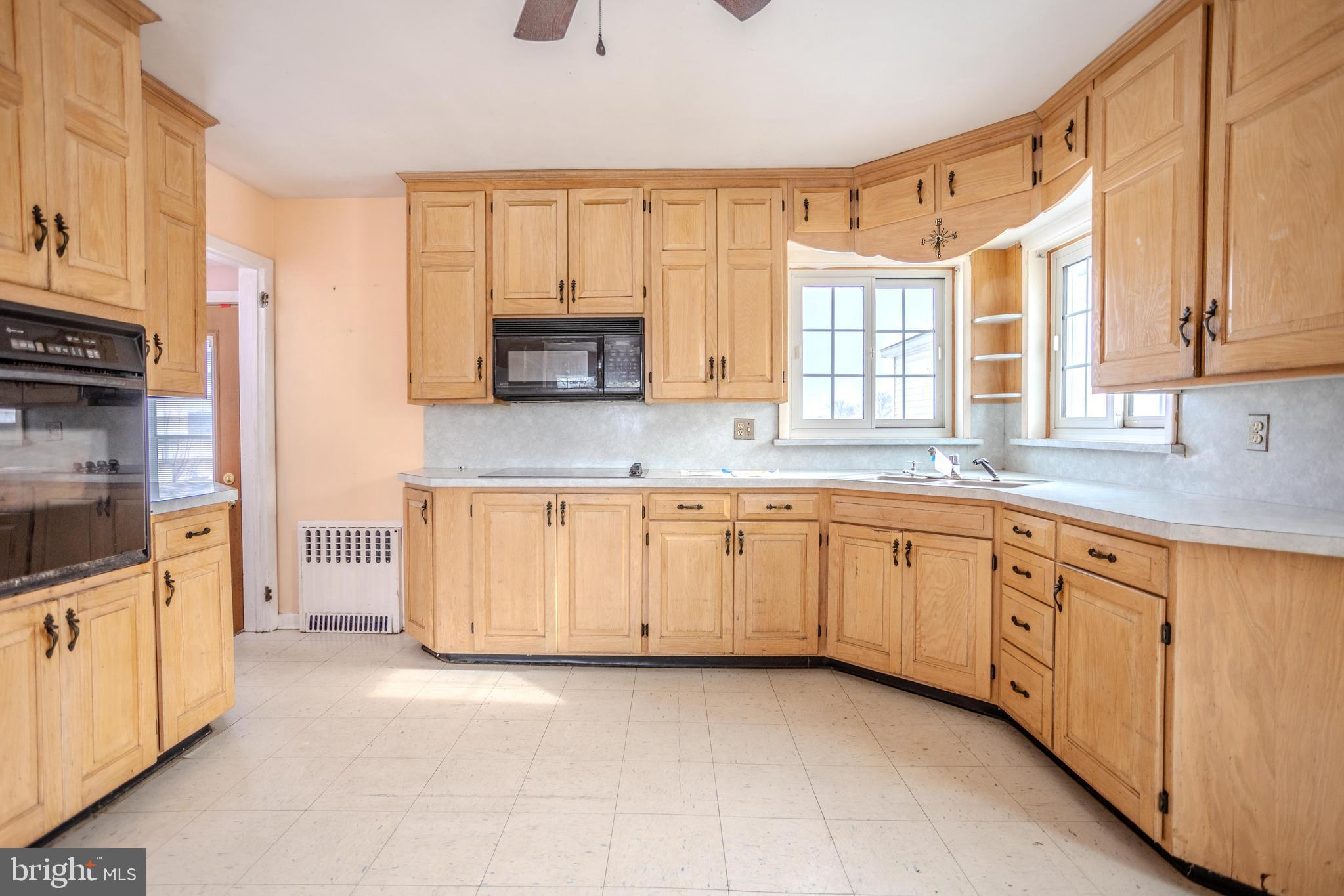 241 Wagner Road Chambersburg, PA 17202 - Photo 13 of 37 a kitchen with granite countertop a stove a sink and a refrigerator