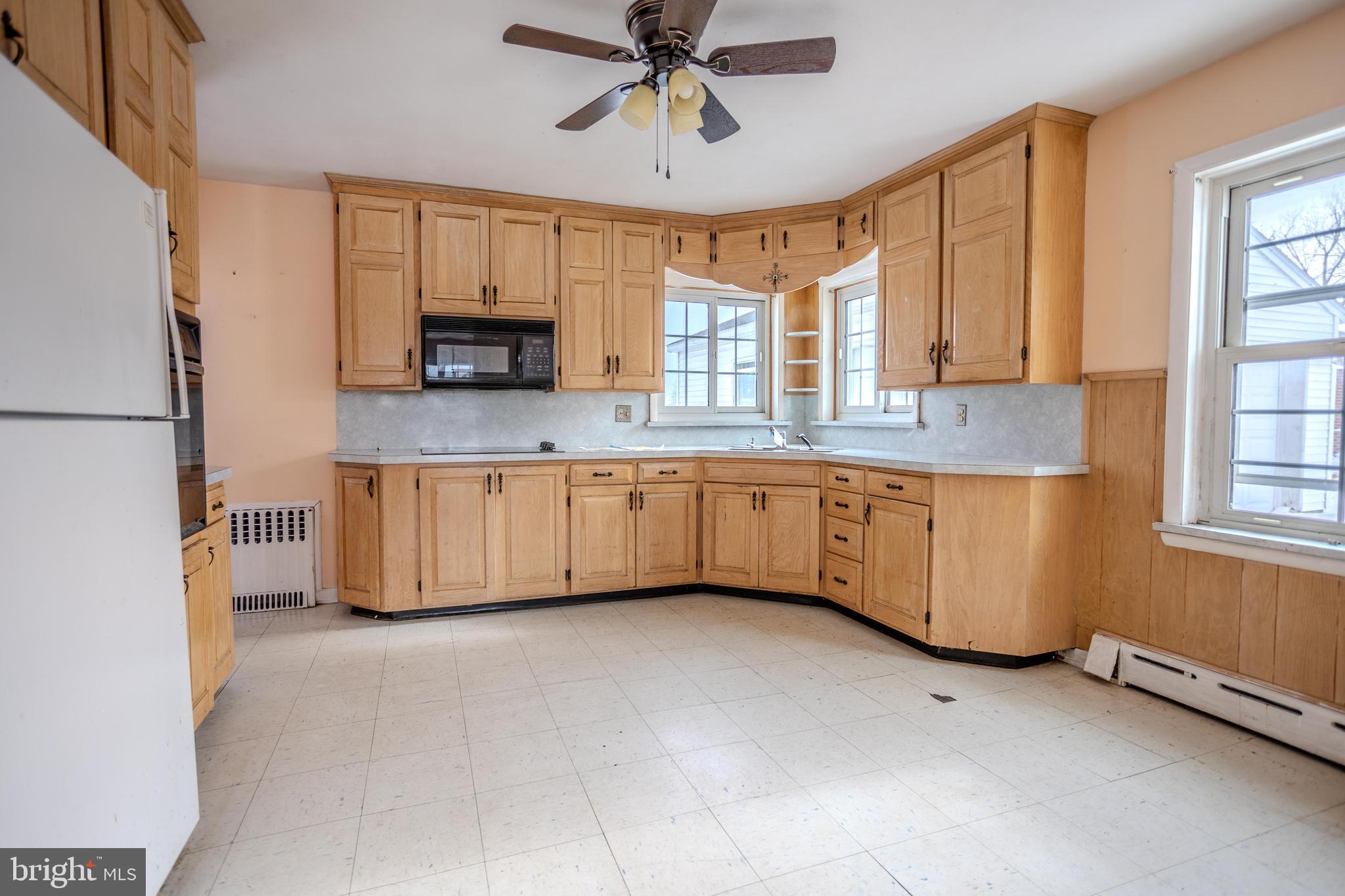 241 Wagner Road Chambersburg, PA 17202 - Photo 14 of 37 a large kitchen with a large window appliances and cabinets