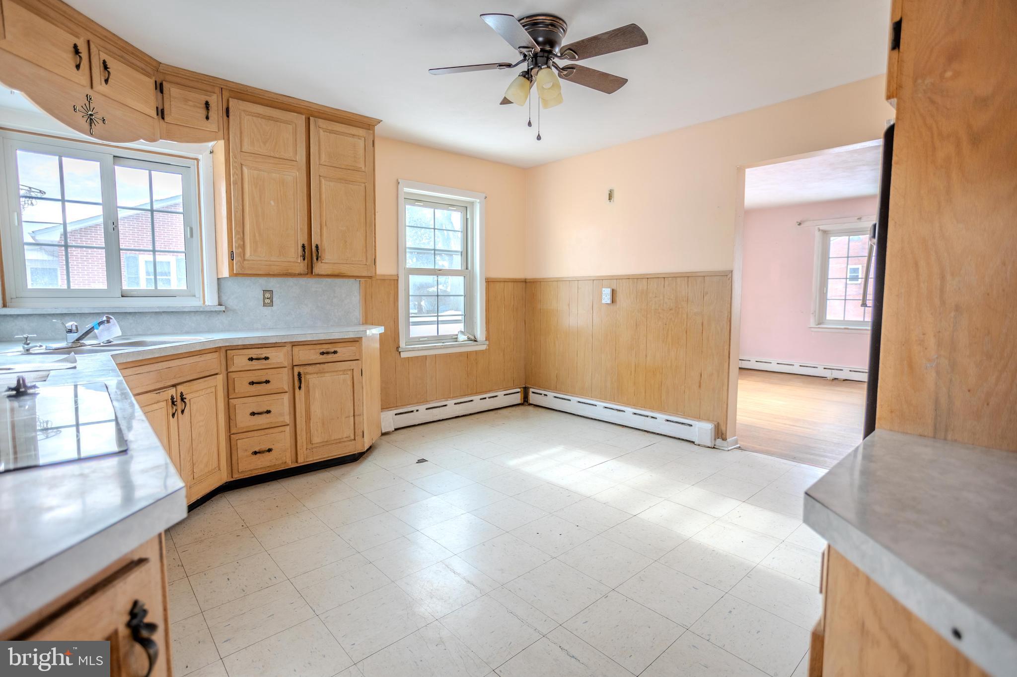 241 Wagner Road Chambersburg, PA 17202 - Photo 16 of 37 a view of a kitchen with a sink and dishwasher cabinet with a fireplace