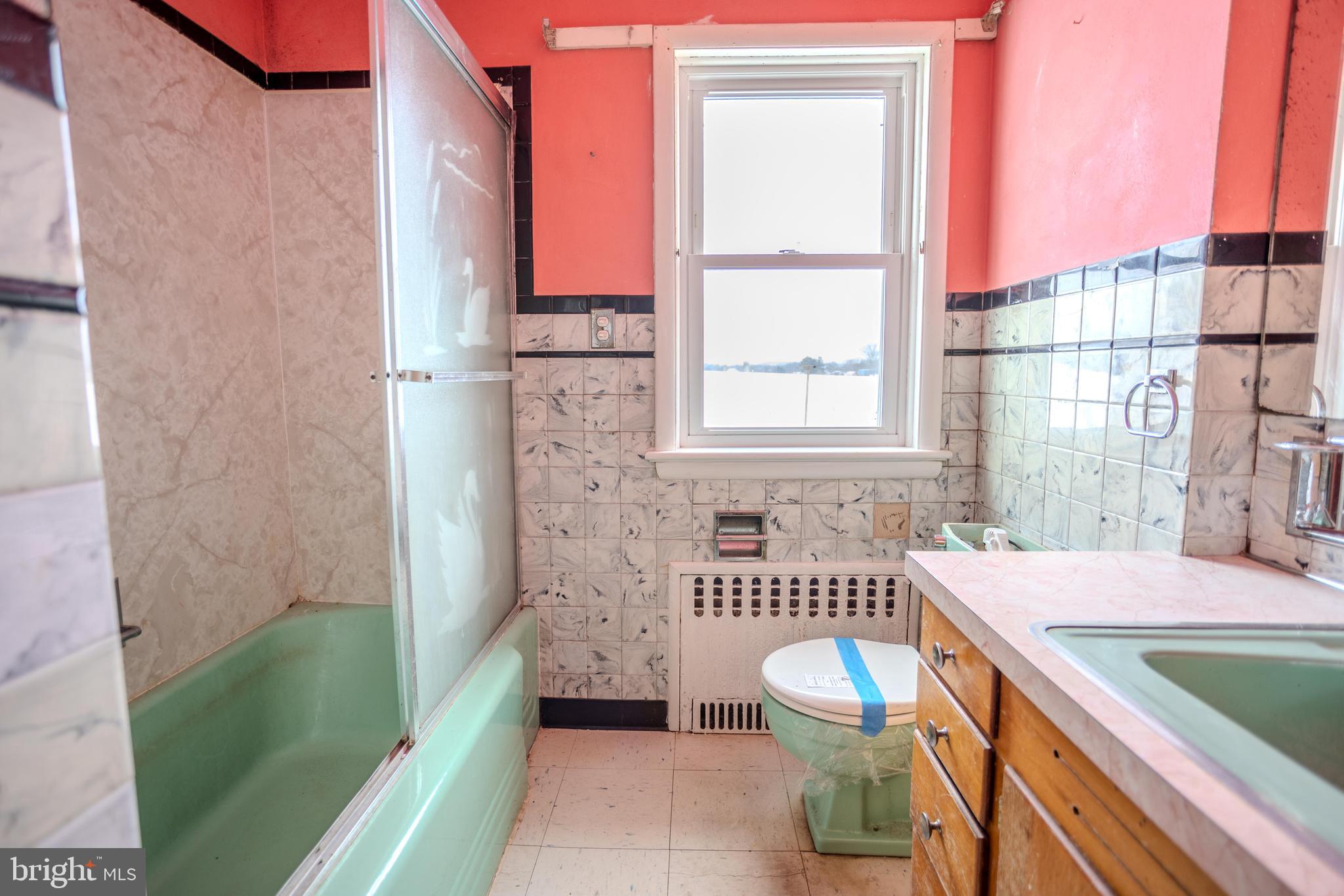 241 Wagner Road Chambersburg, PA 17202 - Photo 24 of 37 a bathroom with a sink a toilet a mirror and bathtub