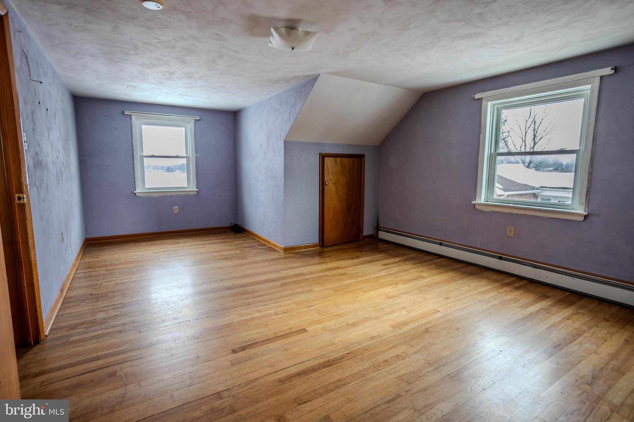 241 Wagner Road Chambersburg, PA 17202 - Photo 26 of 37 an empty room with wooden floor and windows