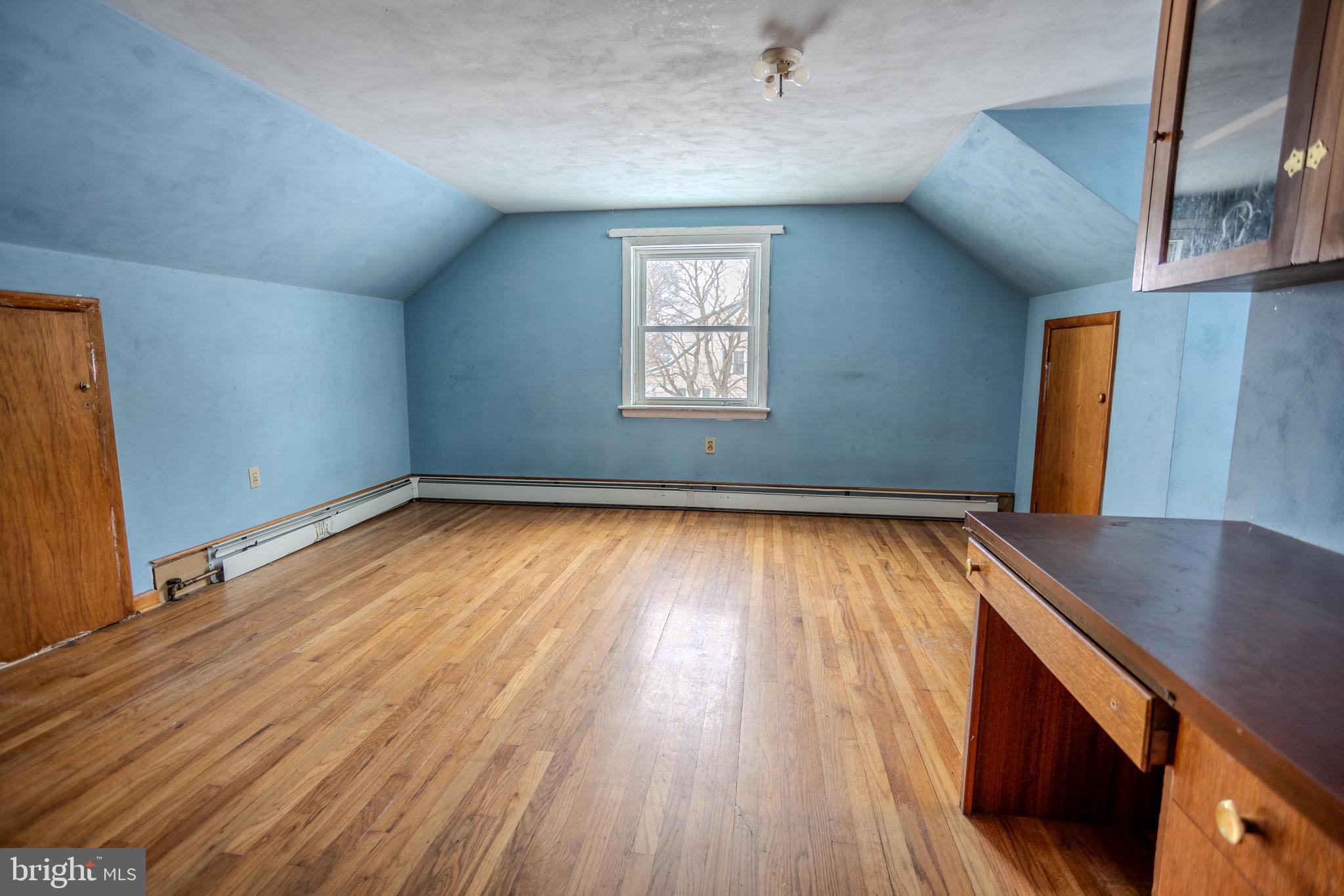 241 Wagner Road Chambersburg, PA 17202 - Photo 32 of 37 an empty room with wooden floor and windows