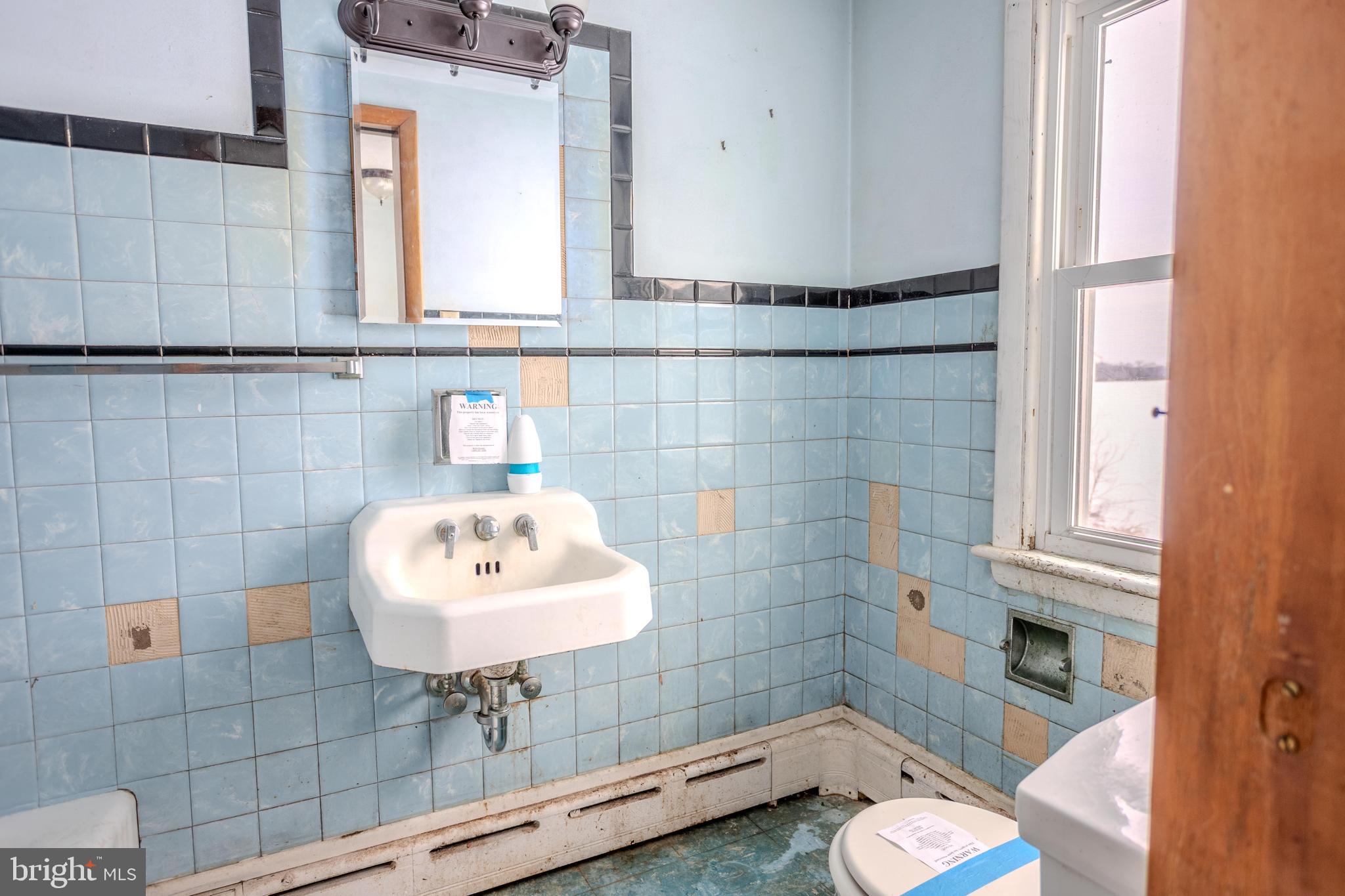 241 Wagner Road Chambersburg, PA 17202 - Photo 34 of 37 a bathroom with a sink and a mirror