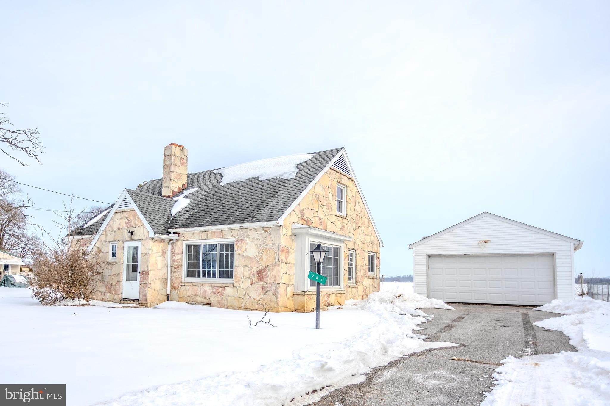 241 Wagner Road Chambersburg, PA 17202 - Photo 4 of 37 a front view of a house with a yard