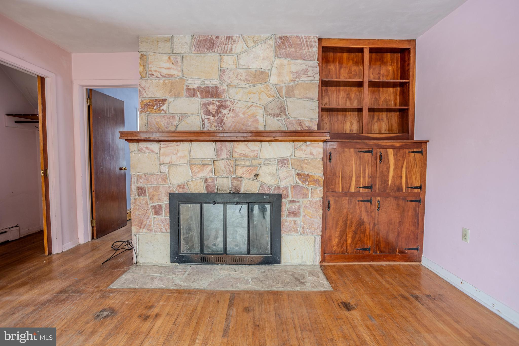 241 Wagner Road Chambersburg, PA 17202 - Photo 8 of 37 a view of a fireplace with wooden floor