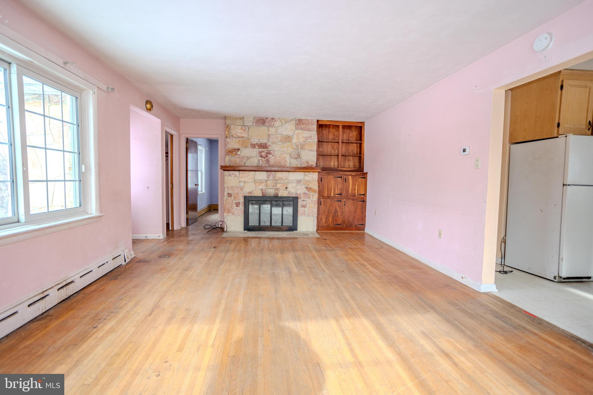 241 Wagner Road Chambersburg, PA 17202 - Photo 9 of 37 wooden floor in an empty room with a window