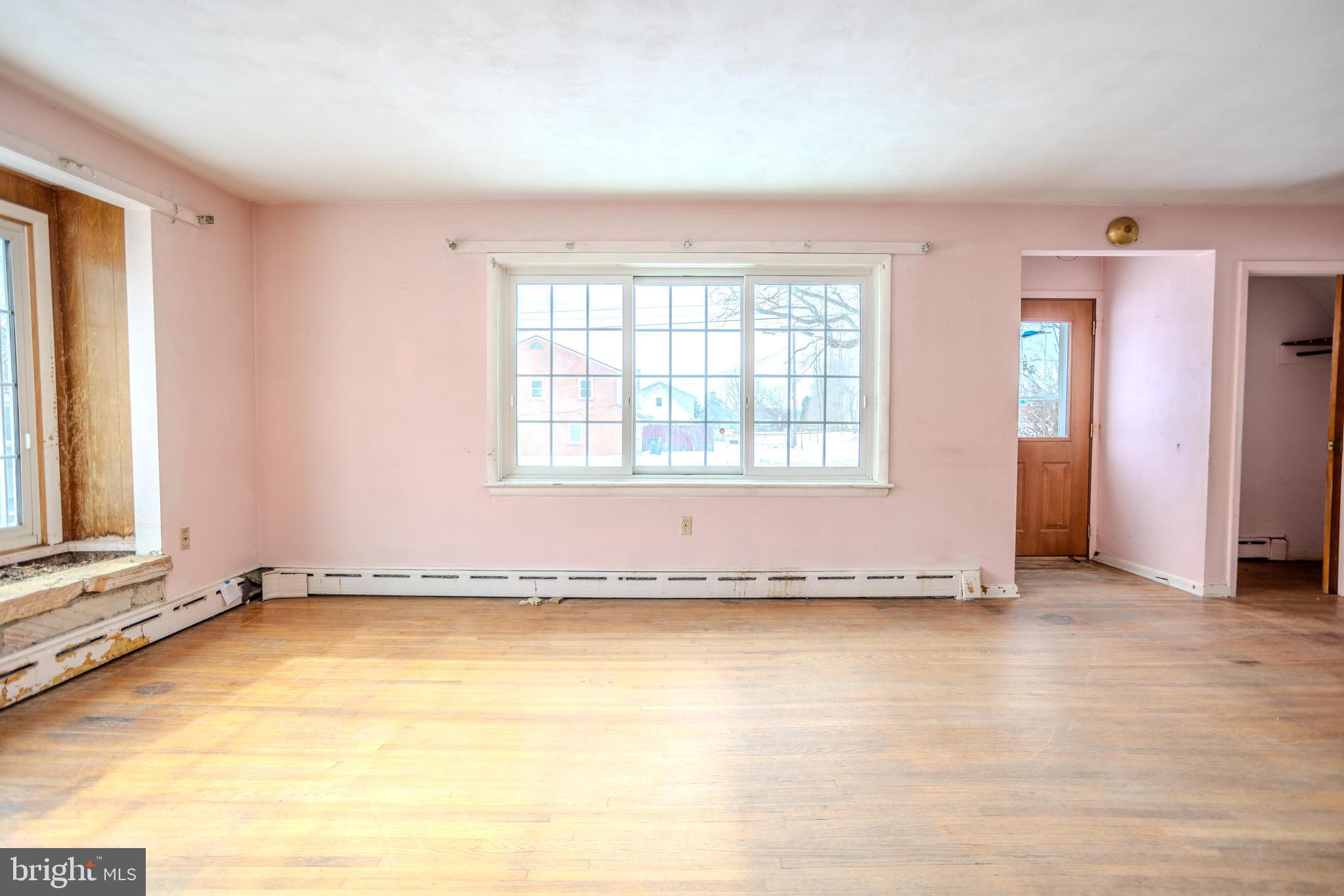 241 Wagner Road Chambersburg, PA 17202 - Photo 10 of 37 an empty room with wooden floor and windows