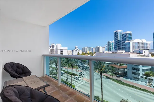 a roof deck with couch and city view