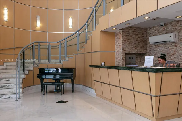 a view of a lobby with chair and floor to ceiling window