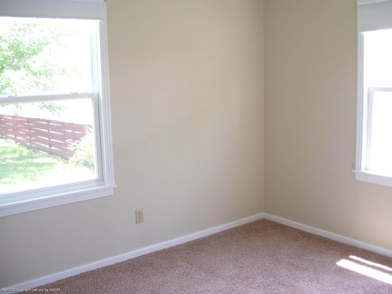 4641 Parker Street Amarillo, TX 79110 - Photo 7 of 8 an empty room with a window