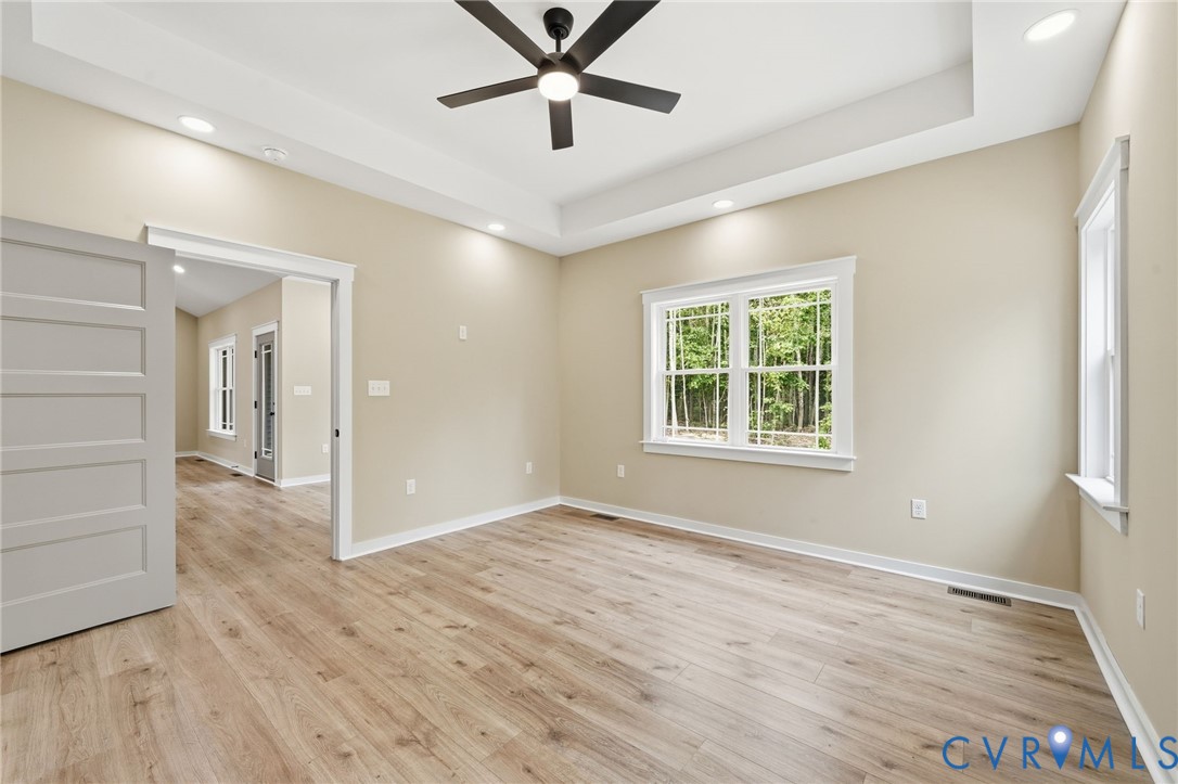 239 Bumpass Road Bumpass, VA 23024 - Photo 25 of 44 Spacious room featuring wood-finish flooring, a tr