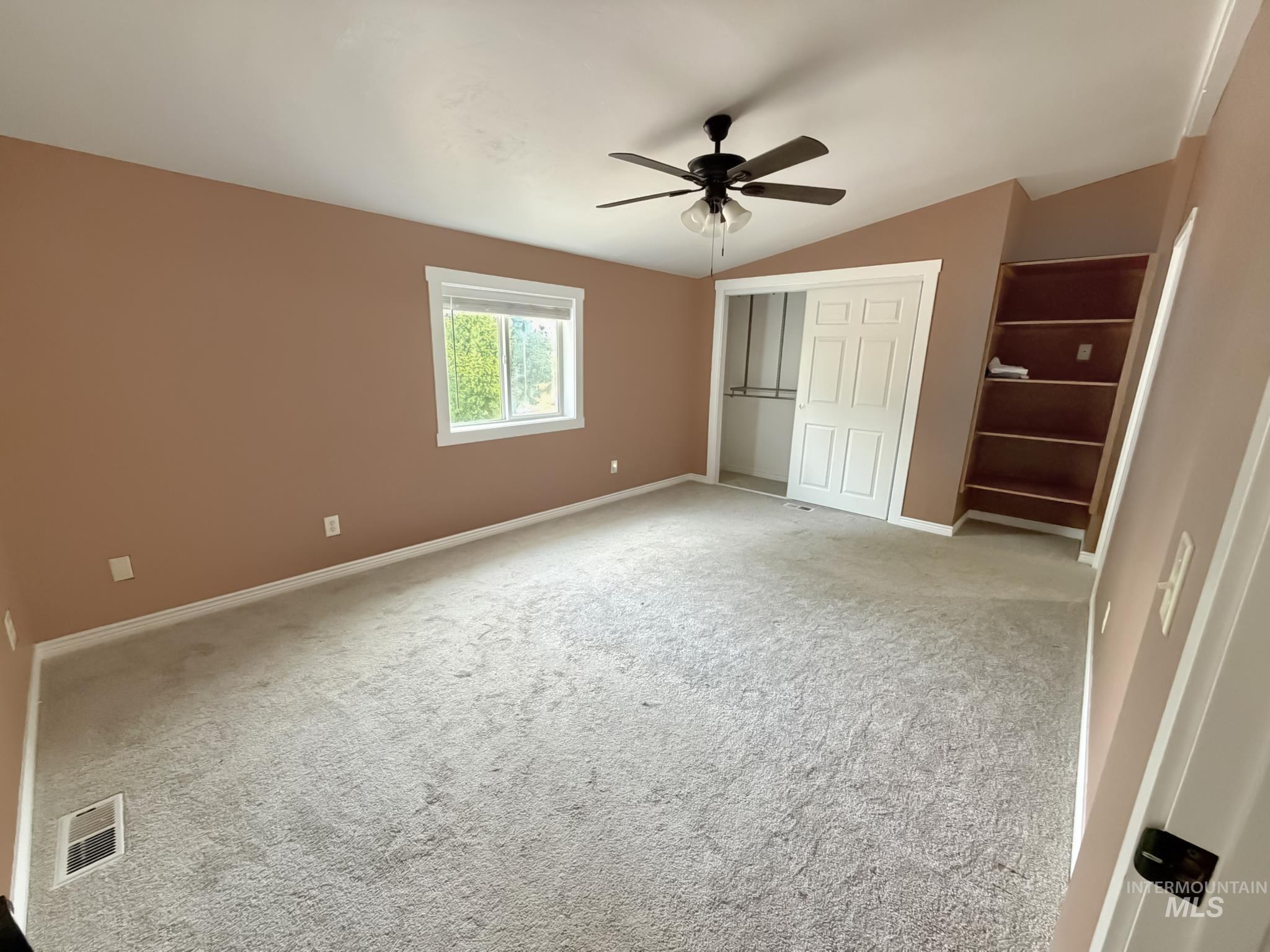 2469 Hague Road Midvale, ID 83645 - Photo 19 of 50 Spacious room featuring neutral carpeting, a ceiling fan, and a window with white trim