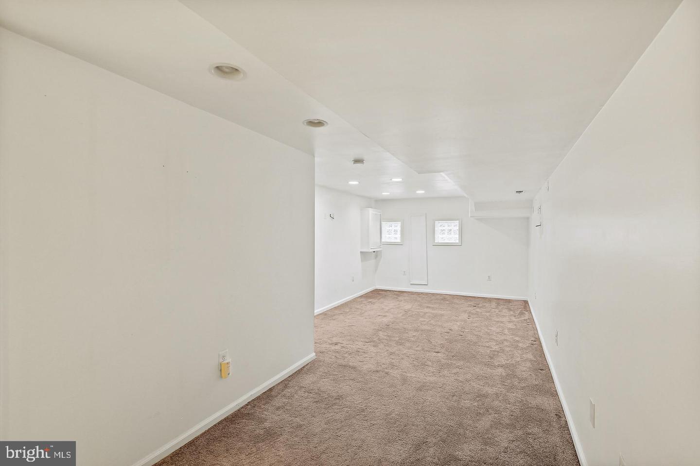 1723 Clarkson Street Baltimore, MD 21230 - Photo 12 of 27 an empty room with a empty space and windows