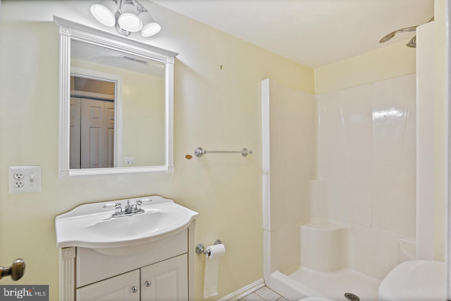 1723 Clarkson Street Baltimore, MD 21230 - Photo 14 of 27 a bathroom with a sink toilet and shower