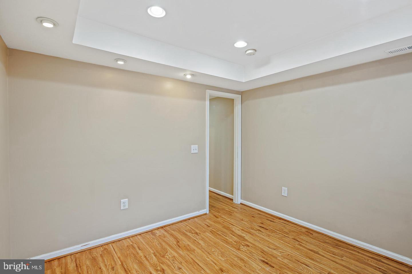 1723 Clarkson Street Baltimore, MD 21230 - Photo 19 of 27 a view of an empty room with wooden floor