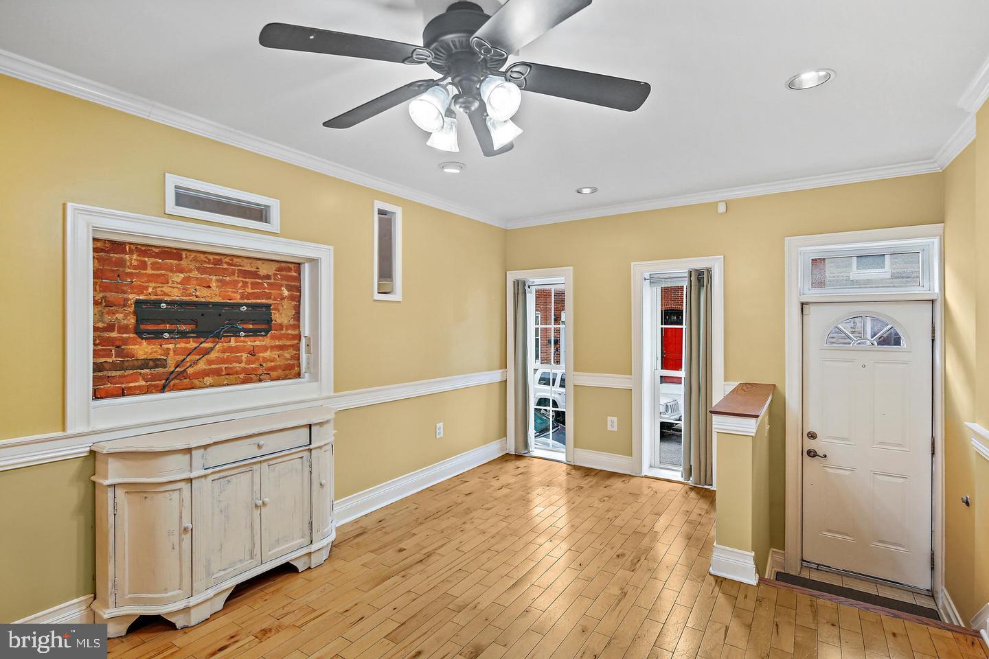 1723 Clarkson Street Baltimore, MD 21230 - Photo 4 of 27 a view of empty room with wooden floor