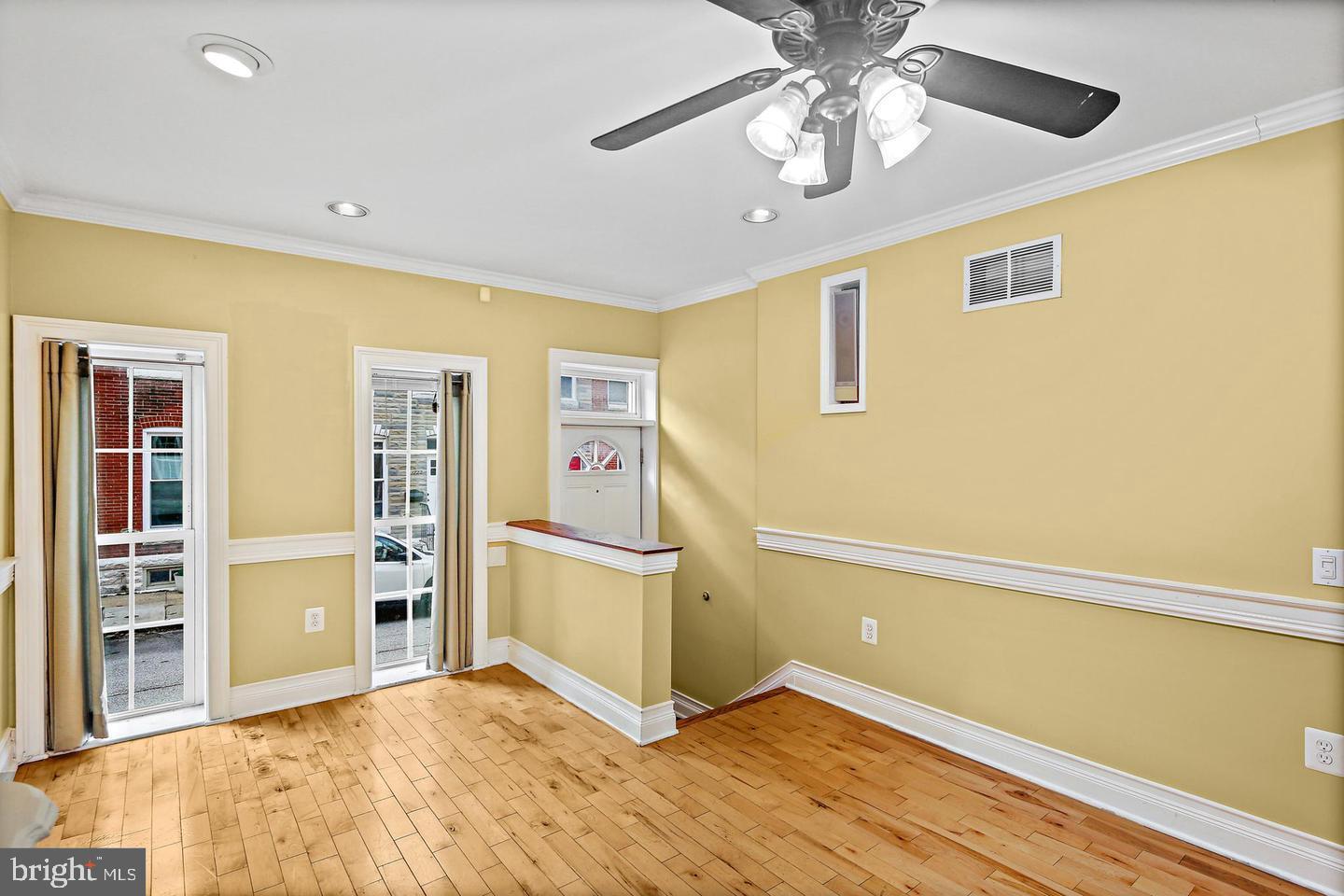 1723 Clarkson Street Baltimore, MD 21230 - Photo 5 of 27 a view of empty room with wooden floor