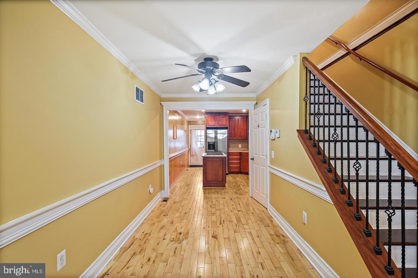 1723 Clarkson Street Baltimore, MD 21230 - Photo 6 of 27 a view of a room with wooden floor and staircase