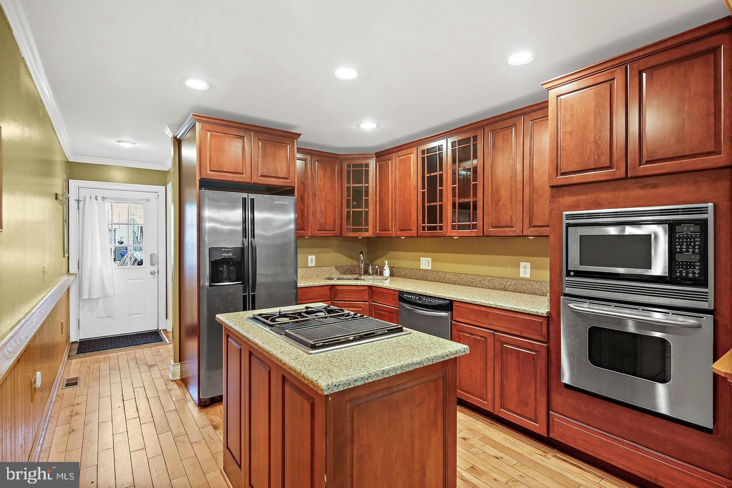 1723 Clarkson Street Baltimore, MD 21230 - Photo 7 of 27 a kitchen with a stove sink and refrigerator