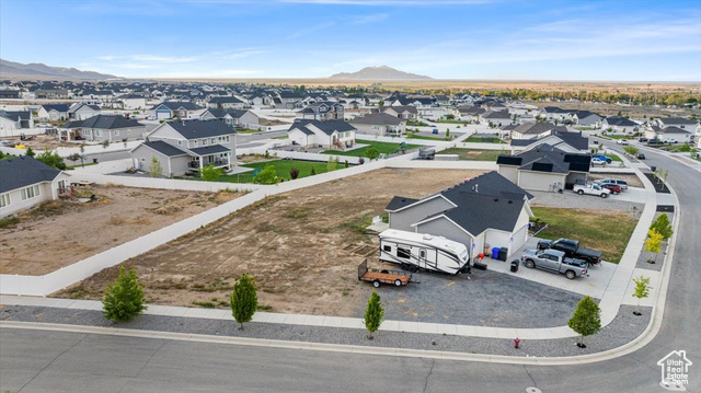 464 South Trejo Rdg Road Grantsville, UT 84029 - Photo 30 of 33 Aerial perspective of suburban area featuring a mountainous background