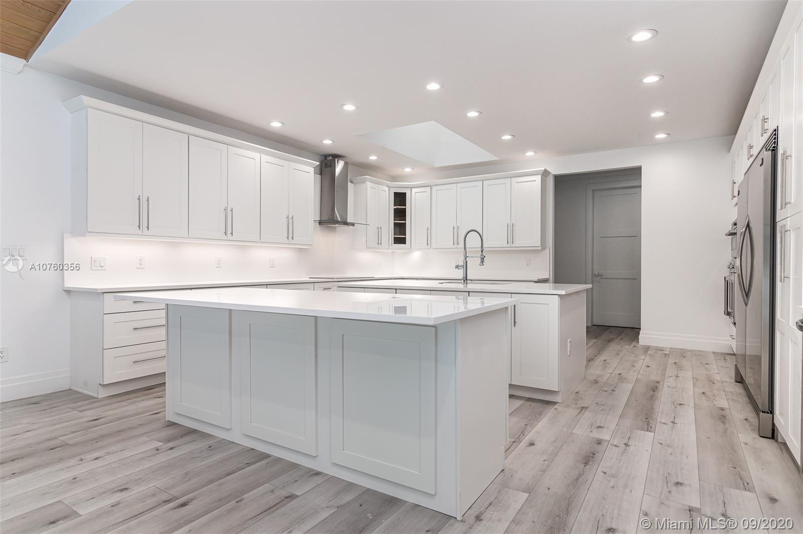 575 Sandpiper Way Boca Raton, FL 33431 - Photo 3 of 56 Brand New XXL open chef's kitchen featuring Top of the Line SS appliances, chrome finishes, custom wood shaker cabinets, quartz countertops and back splash, endless seating and storage!