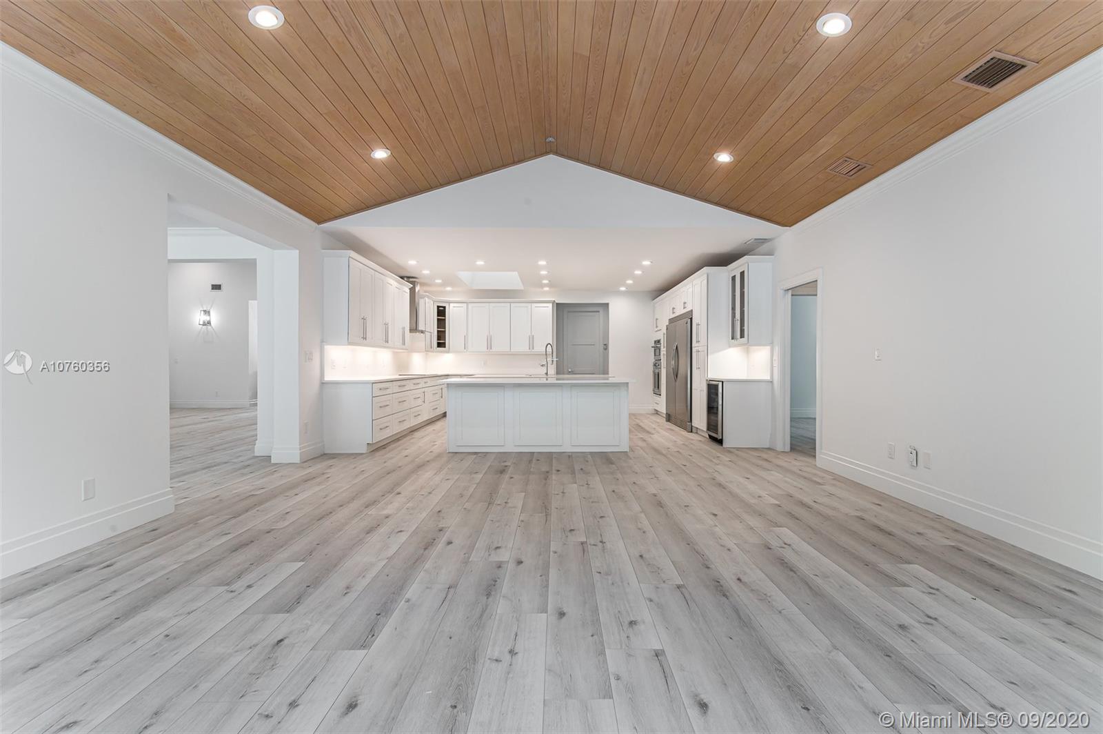 575 Sandpiper Way Boca Raton, FL 33431 - Photo 10 of 56 Brand New XXL open chef's kitchen featuring Top of the Line SS appliances, chrome finishes, custom wood shaker cabinets, quartz countertops and back splash, endless seating and storage! Open Floor plan - adjacent to the XXL Family Room & Overlooking the scenic Pool/backyard!