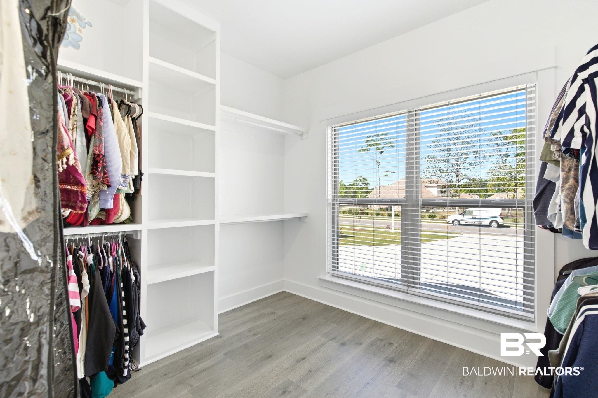 12132 Exbury Way Daphne, AL 36527 - Photo 19 of 47 Walk in closet featuring light wood-style floors