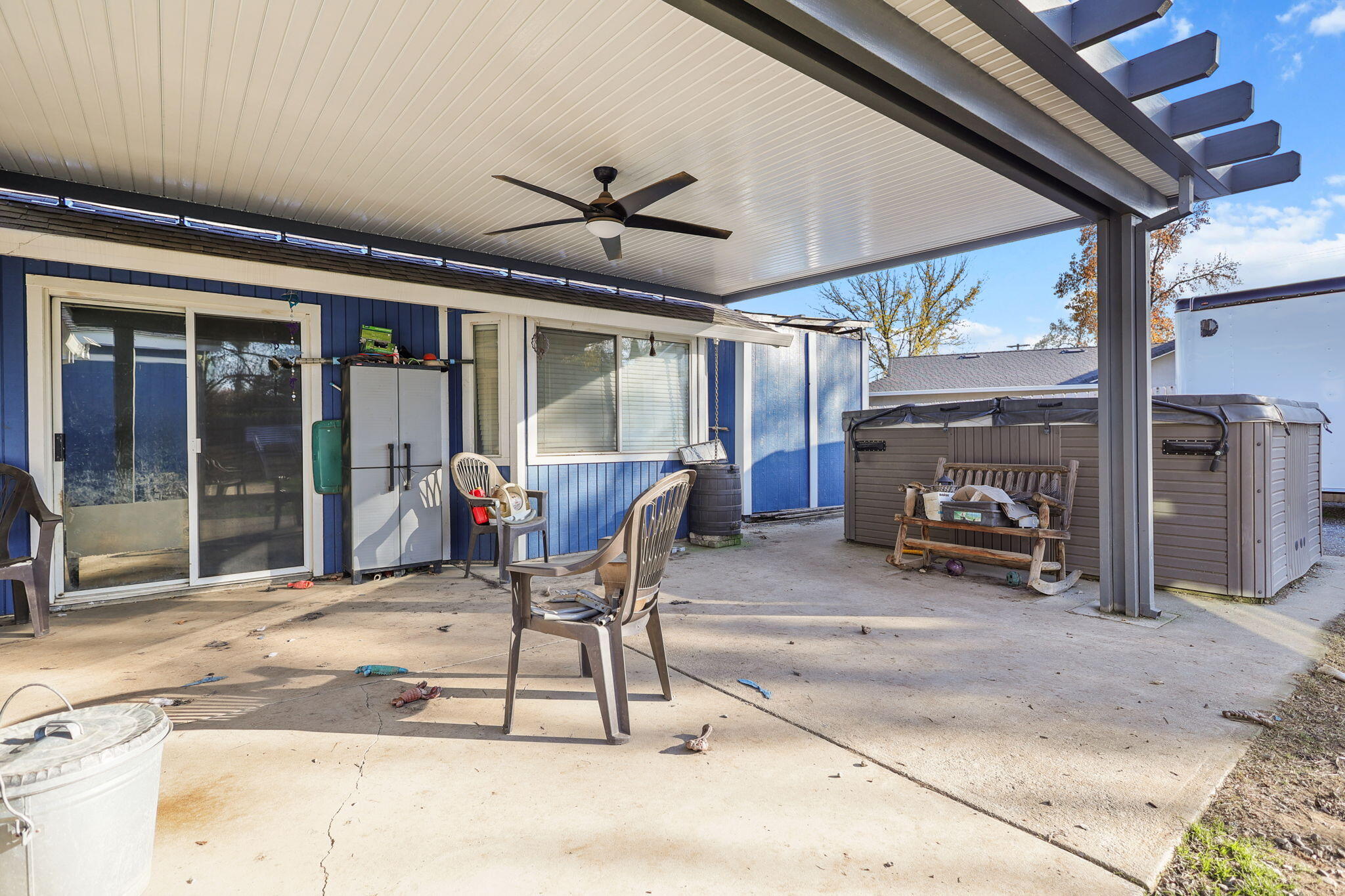 7060 Pit Road Redding, CA 96001 - Photo 11 of 26 a view of a patio with table and chairs and a barbeque