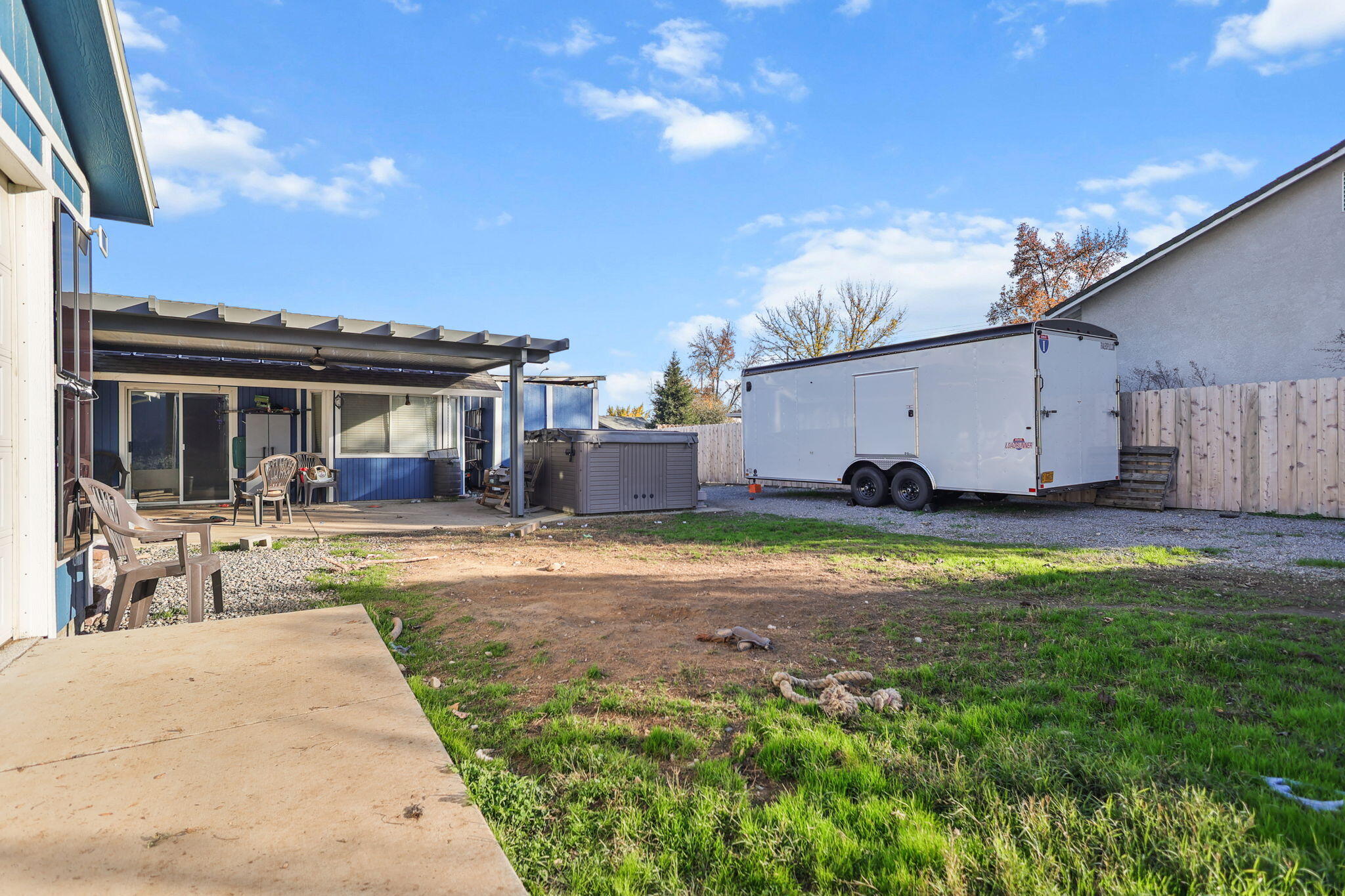 7060 Pit Road Redding, CA 96001 - Photo 14 of 26 a view of a house with backyard and sitting area