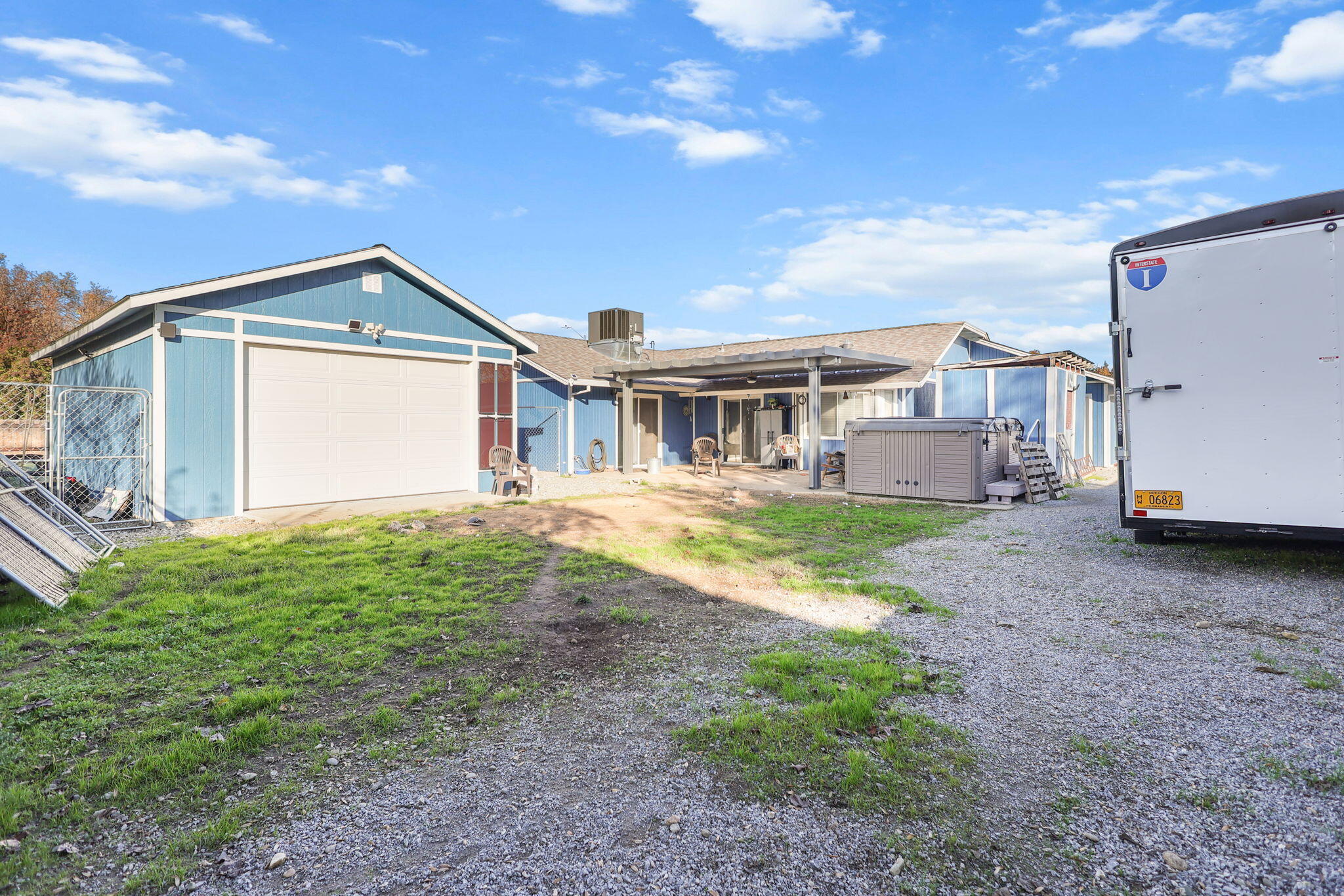 7060 Pit Road Redding, CA 96001 - Photo 18 of 26 a view of a house with a backyard