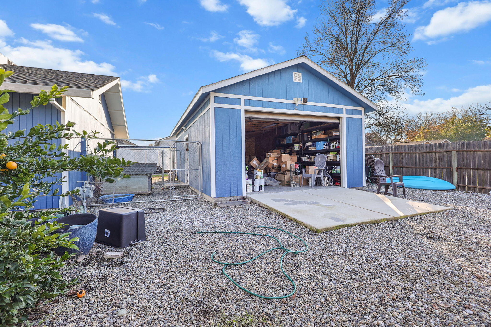 7060 Pit Road Redding, CA 96001 - Photo 23 of 26 a front view of a house with garden