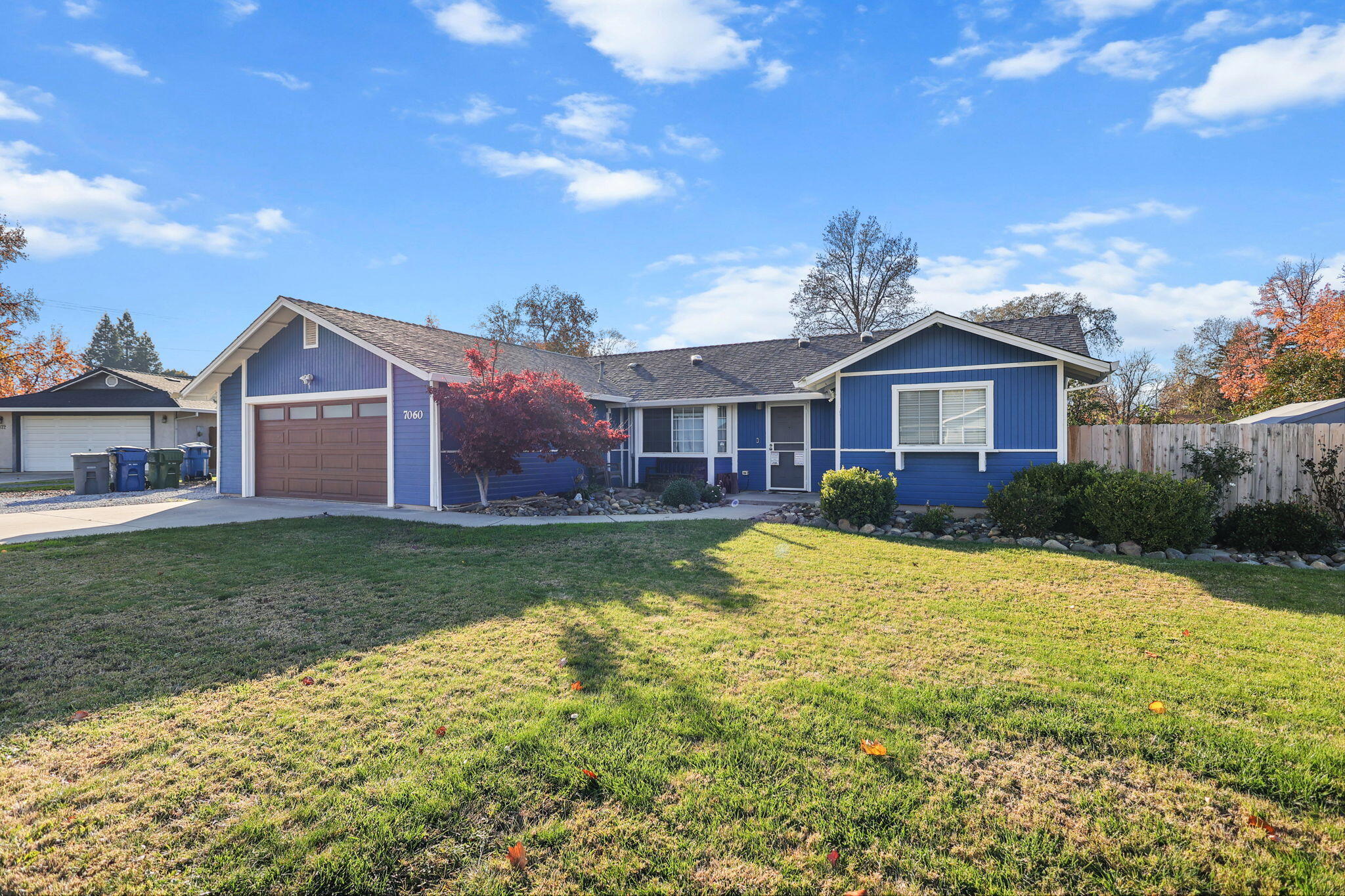 7060 Pit Road Redding, CA 96001 - Photo 25 of 26 a view of a yard in front of a house with a large tree