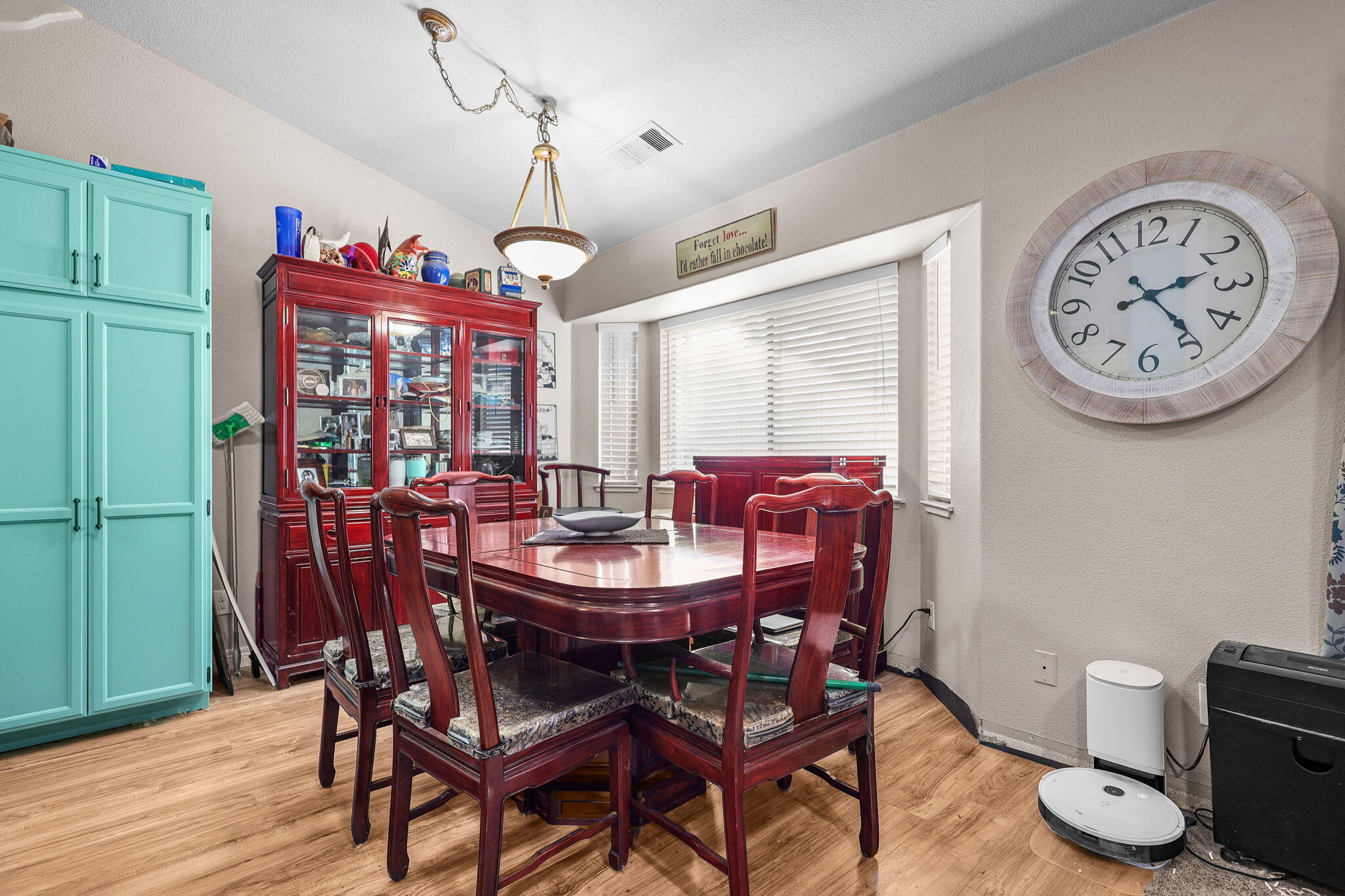 7060 Pit Road Redding, CA 96001 - Photo 3 of 26 a view of a dining room with furniture window and wooden floor