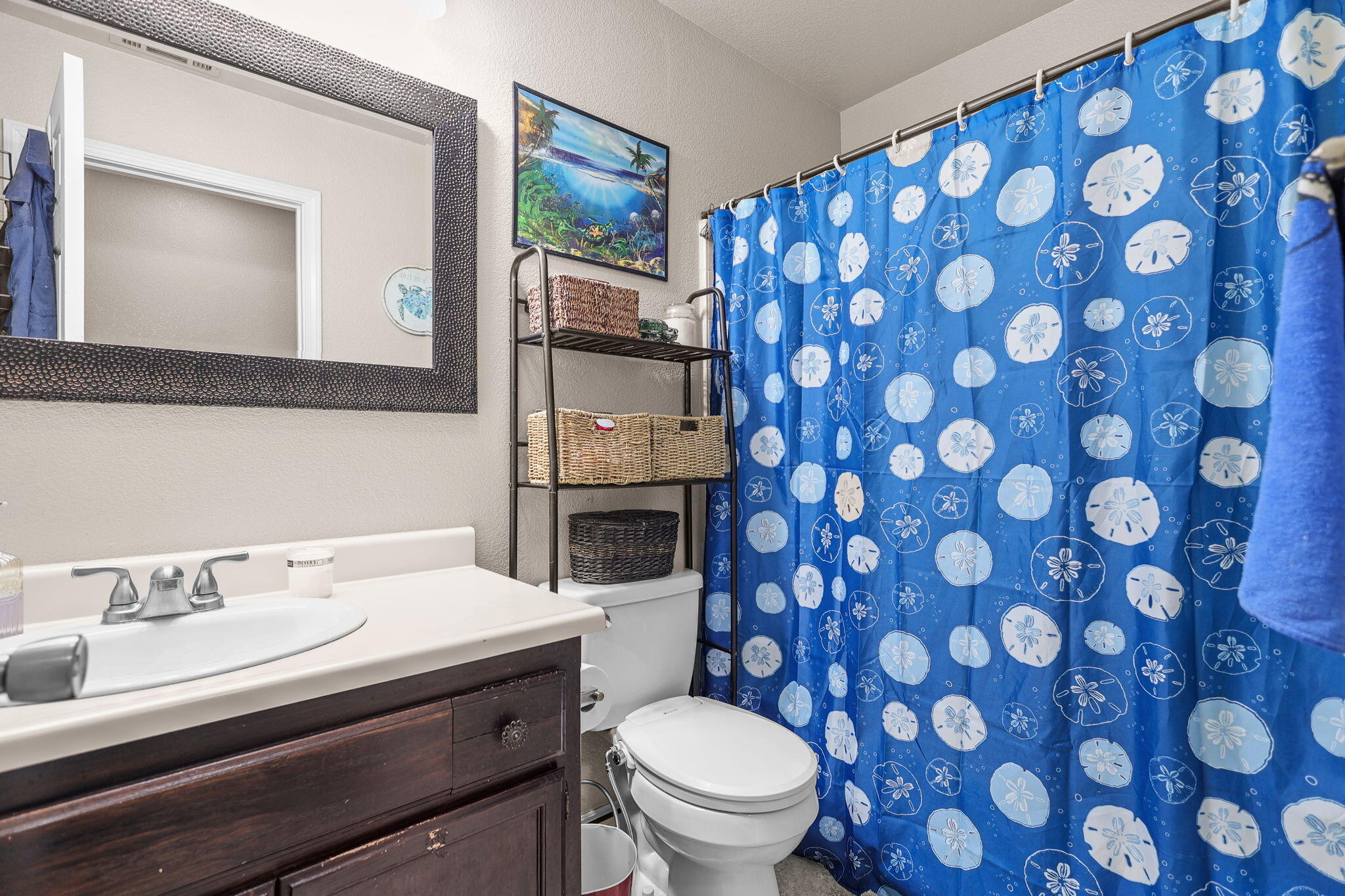 7060 Pit Road Redding, CA 96001 - Photo 6 of 26 a bathroom with a toilet a sink and mirror