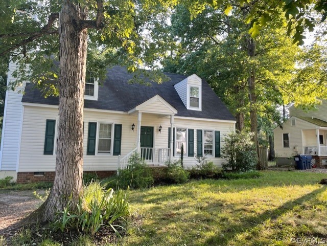 a front view of a house with a yard garage and outdoor seating