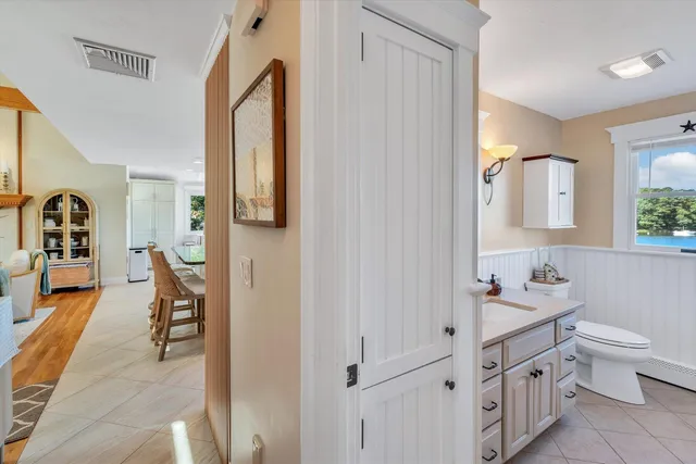 a spacious bedroom with a large bed and a balcony view