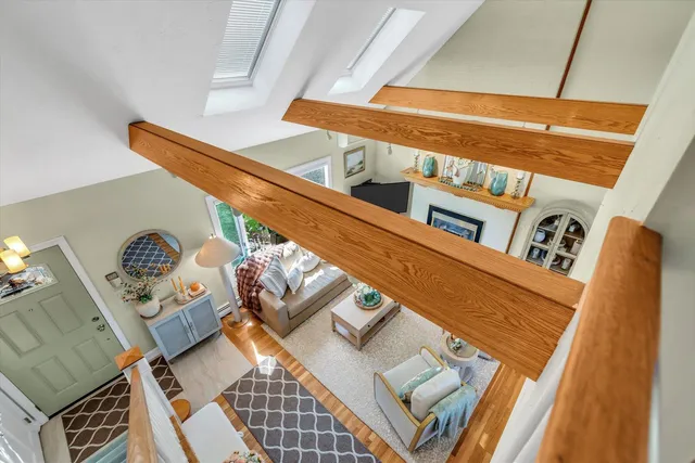 a view of a patio with table and chairs and wooden fence