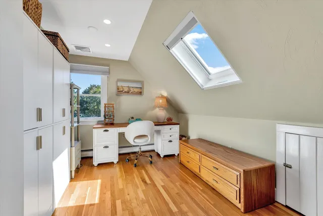 a view of a chair and table in backyard