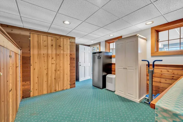 a view of a balcony with table and chairs and wooden floor