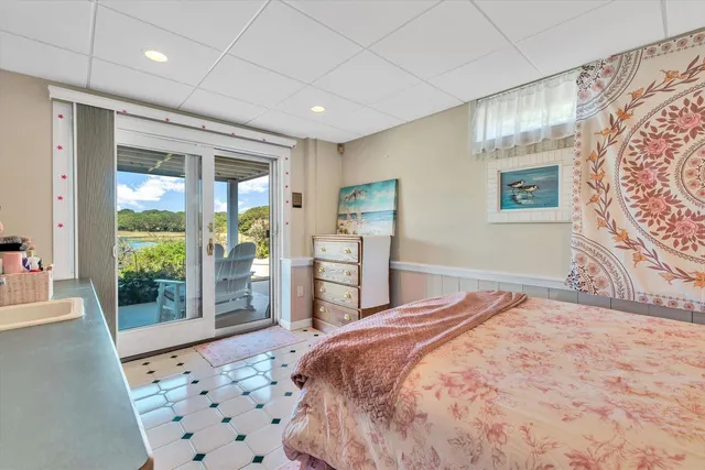 an aerial view of residential houses with outdoor space and swimming pool