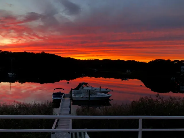 a kitchen with sink a counter top space and living room view