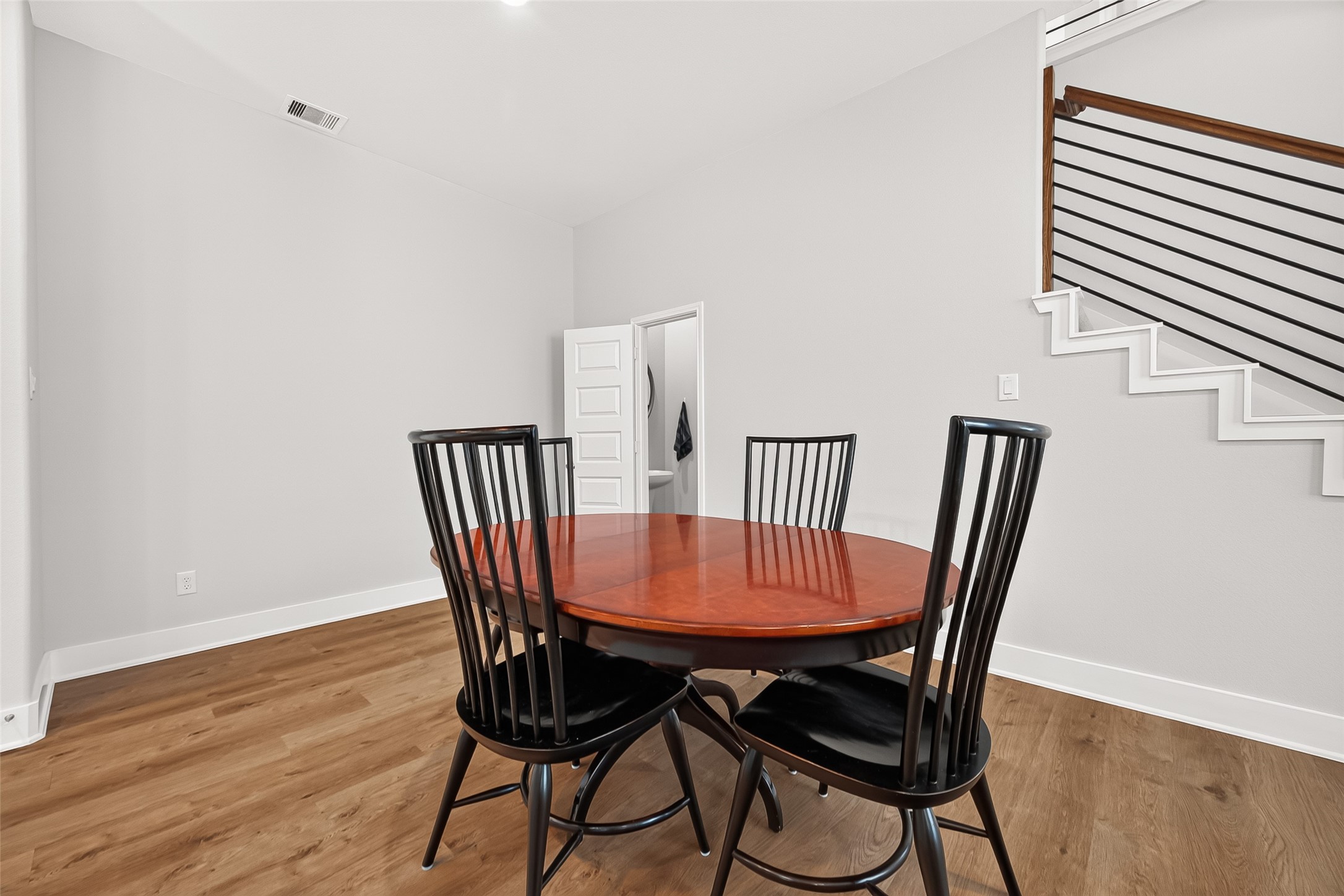 4004 Baja Lane Houston, TX 77045 - Photo 15 of 34 Charming, sunlit, and beautifully placed. This inviting informal dining space sits right at the heart of the home, offering a bright, cheerful ambiance and smooth transitions to the family room and kitchen.