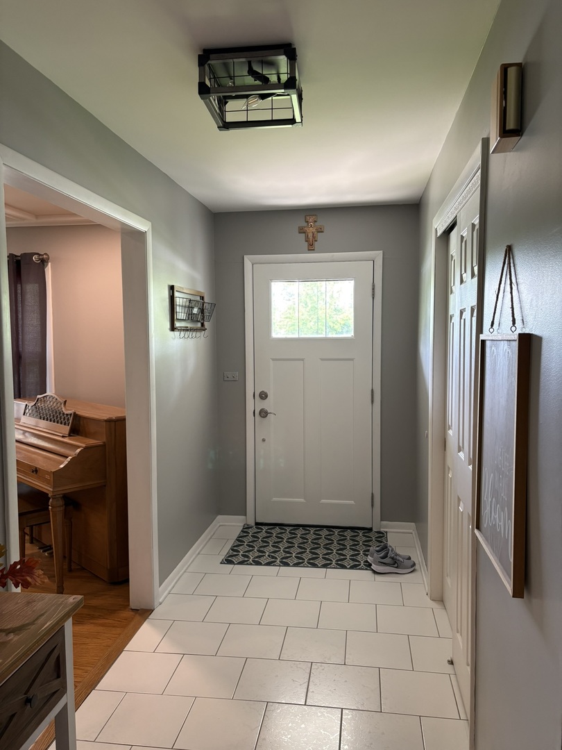 609 West Gartner Road Naperville, IL 60540 - Photo 7 of 23 a view of a hallway with a kitchen