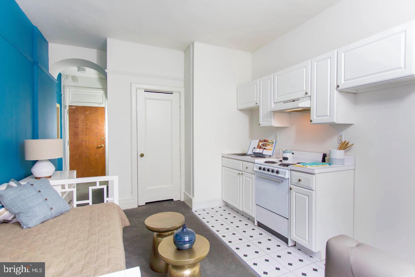 1229 Chestnut Street, Unit 322 Philadelphia, PA 19107 - Photo 13 of 21 a kitchen with stainless steel appliances a stove a sink and a refrigerator