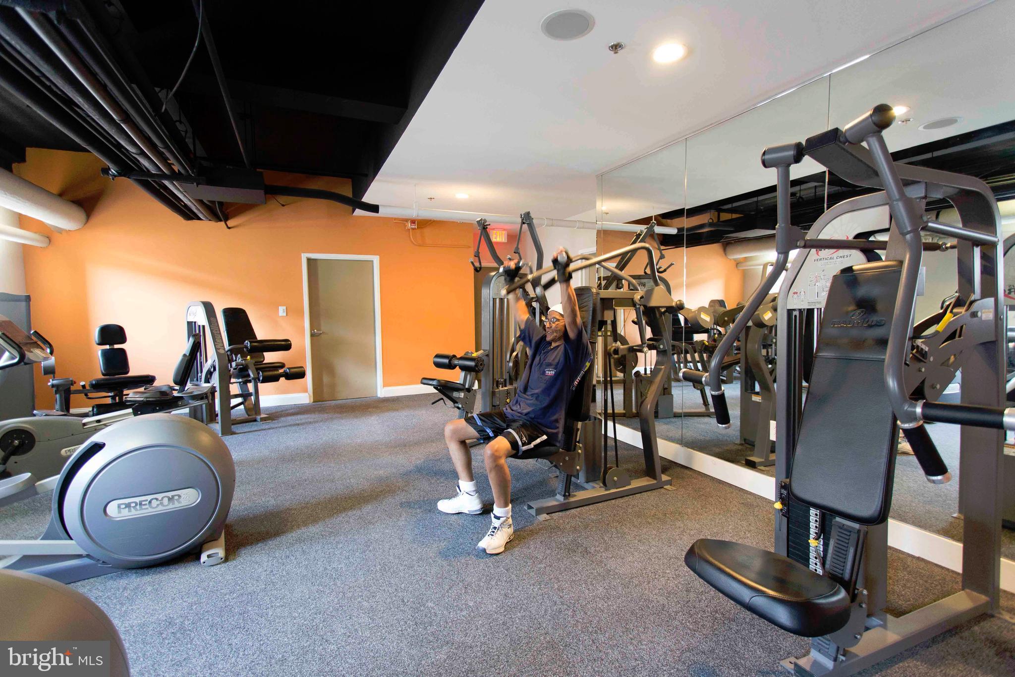 1229 Chestnut Street, Unit 322 Philadelphia, PA 19107 - Photo 9 of 21 a view of a room with gym equipment