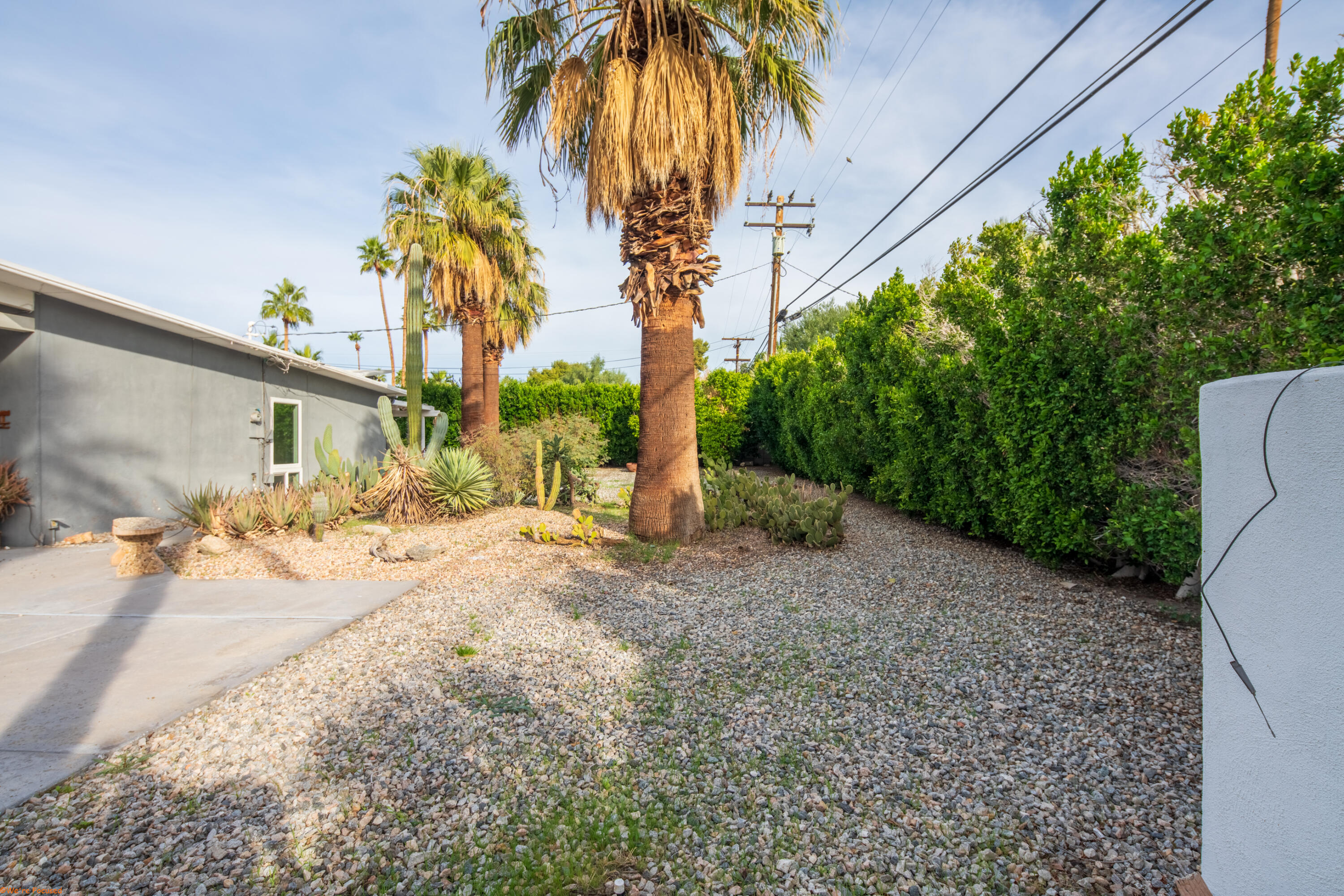 2272 North Starr Road Palm Springs, CA 92262 - Photo 32 of 38 a front view of a house with a yard and garage