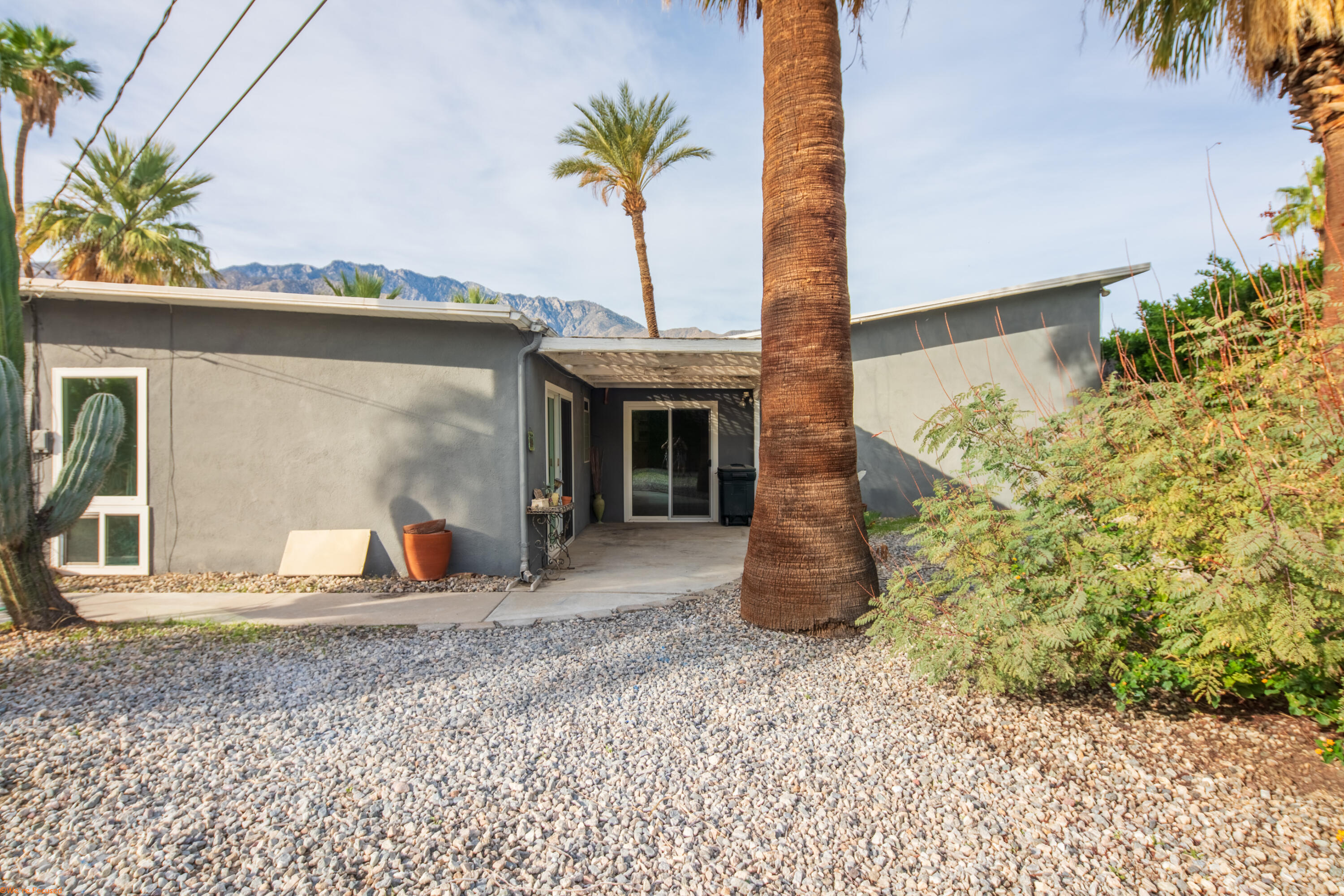 2272 North Starr Road Palm Springs, CA 92262 - Photo 35 of 38 a view of a house with a backyard and windows