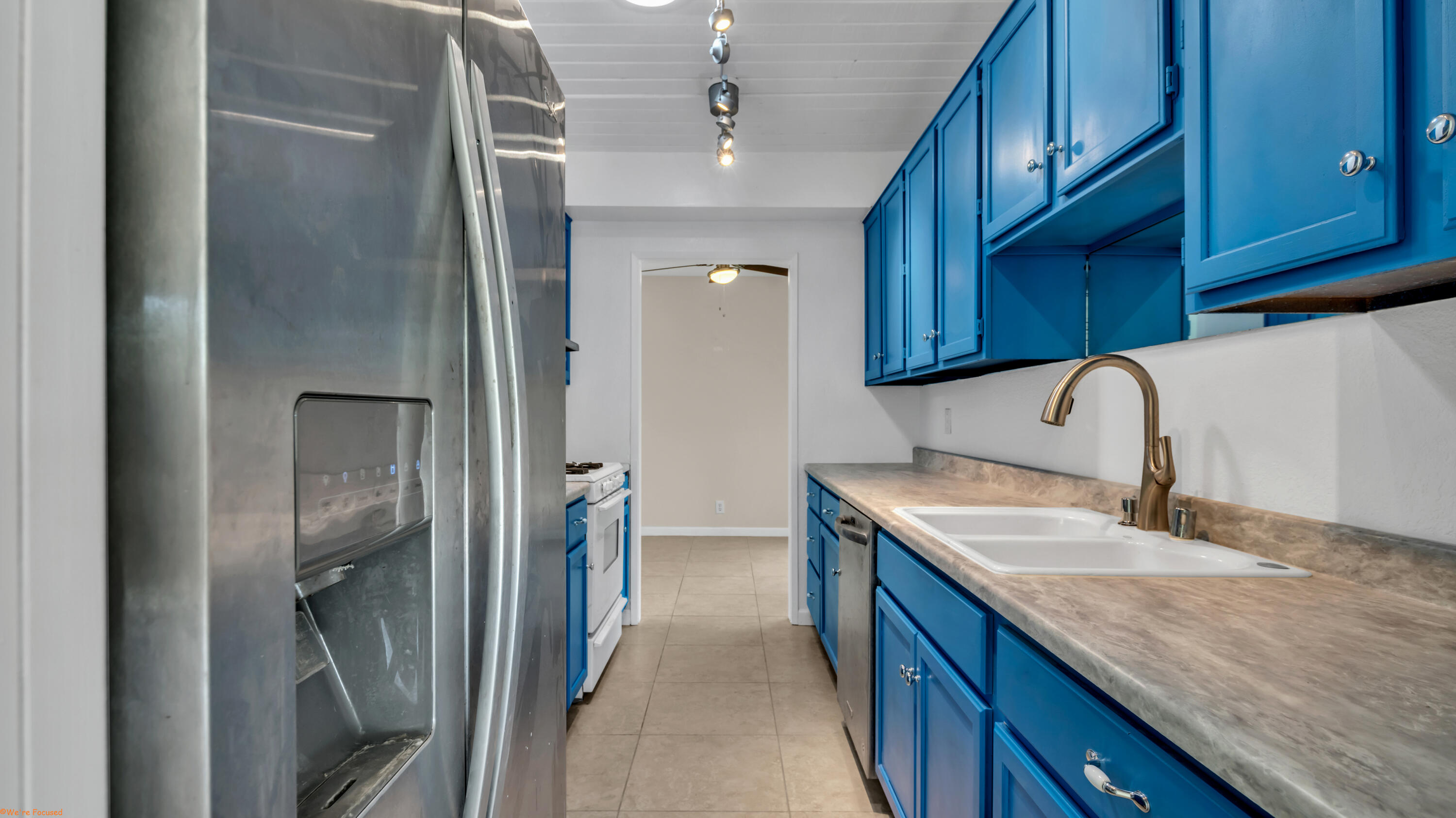 2272 North Starr Road Palm Springs, CA 92262 - Photo 5 of 38 a kitchen with a sink stove and refrigerator
