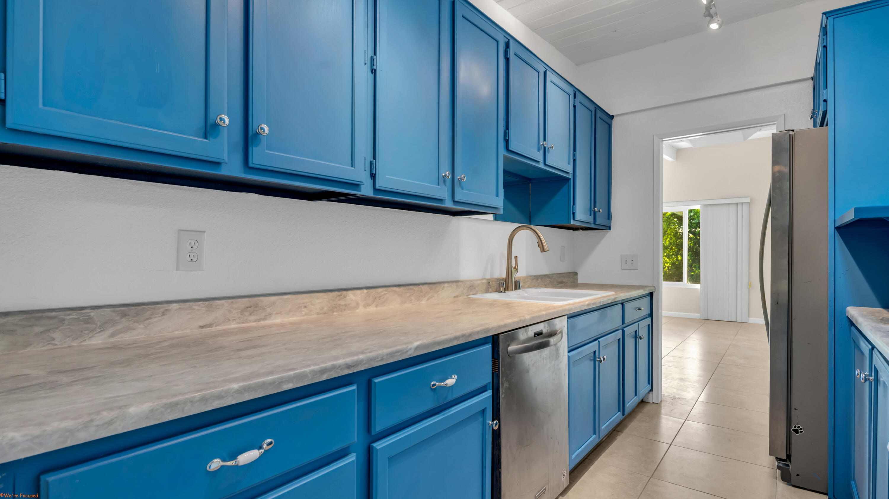 2272 North Starr Road Palm Springs, CA 92262 - Photo 7 of 38 a kitchen with a sink cabinets and stainless steel appliances